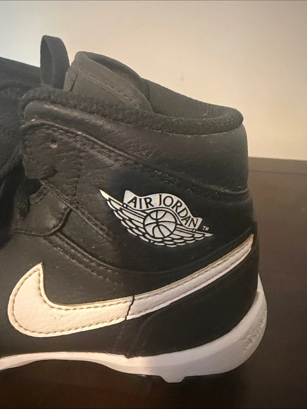 Jordan 1 Mid Cleats. Kids' Black and White High-Top.